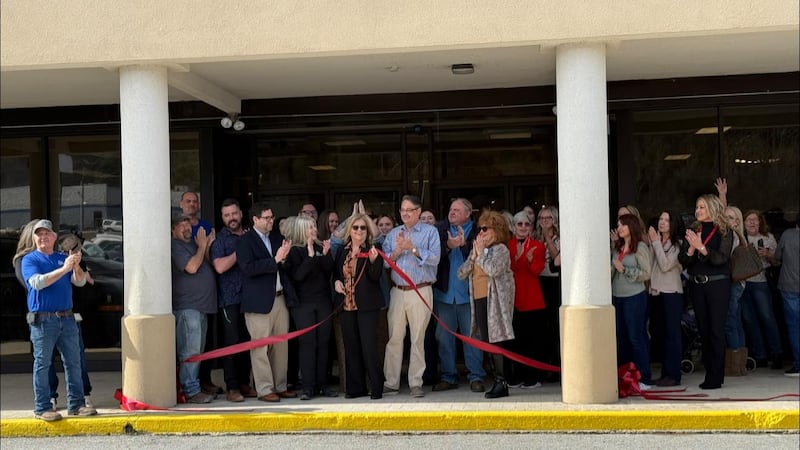 The store reopened Friday with a celebratory ribbon cutting.