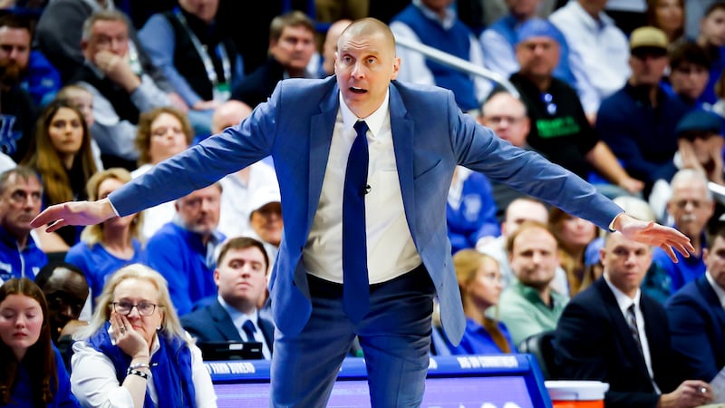 Coach Mark Pope emphasizes defense to Kentucky's players. (Photo by Les Nicholson)