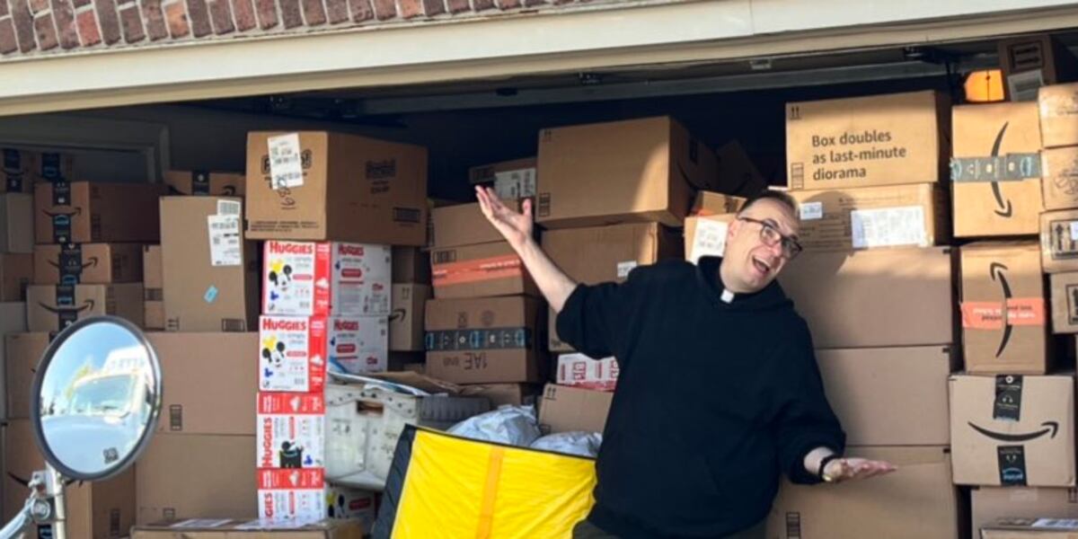 Sichko Father Jim Sichko visits Isom IGA